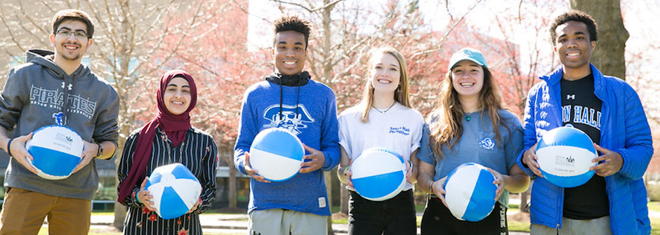 Students on green with beach balls