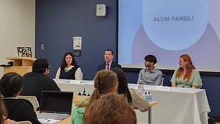 Panel of graduate comm-arts students.Panel of commarts graduate students giving advice to a small crowd. 