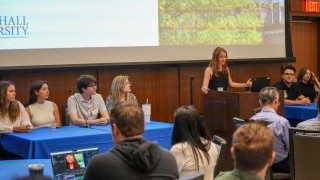 Student panelists discussing their experience with AI at the Symposium.