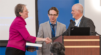 Manfred Minimair, professor of Mathematics and Computer Science and chairperson of the 2023 NJBDA Symposium, welcomes the audience to the eventAssociate Professor of Political Science & Public Affairs Matthew Hale, who also serves as the president of the NJBDA, and Professor Minimair greet Keynote Speaker Kjersten Moody, Prudential Financial’s Chief Data Officer.