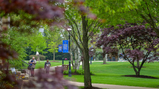 Community members walking on campus.