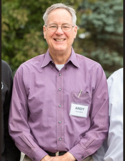 A headshot of Deacon Andrew Saunders