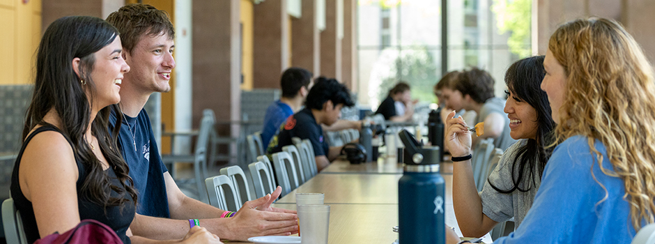 Students dining together in the cafeteria. 
