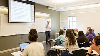 Professor seen hosting a diplomacy lecture.