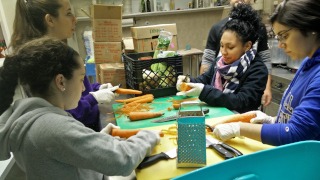 A photo of students volunteering at a foodbank.