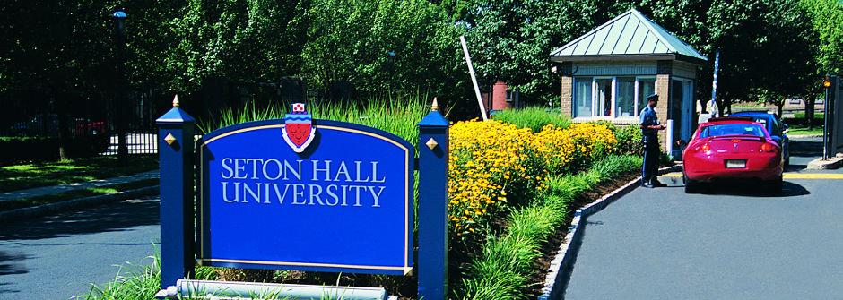 Cars entering campus through the Farinella Gate. 