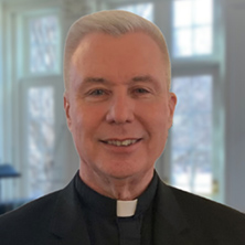 Father Paul Manning posing