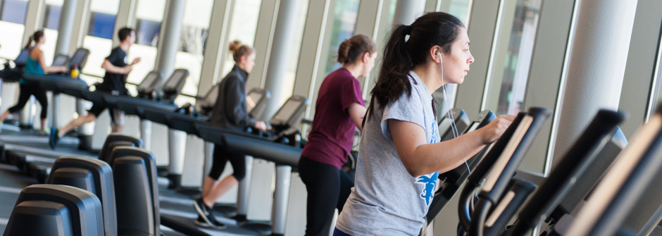 Students on treadmills at the gym. 