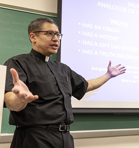 Fr. Ortiz teaching a class at Seton Hall.