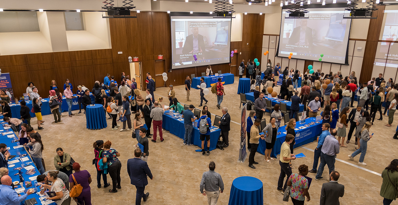 People at Graduate Open House in Bethany Hall.