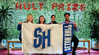 Assistant Professor Debra Lee Surface and Stillman students Morgan Frye, Nalani Rios, and Bryce Miller (L-to-R) traveled to Boston to present their concept Naturefill Replenish, which was recognized with a top prize.