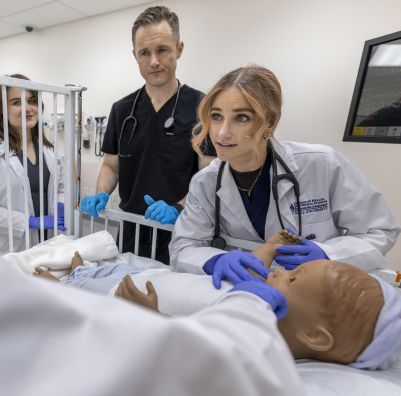 SHU Physician Assistant working with mannequin