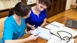 Medical professionals studying together.