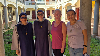 Michelle Peterson poses with volunteers.