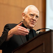 Monsignor Liddy speaking at an event