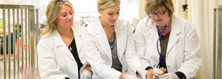 Nurses working with patient