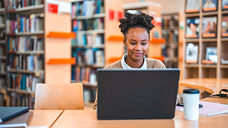 Woman submitting a request on a laptop