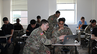 Color Guard presenting the flag during a basketball game. 