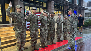 Image of members of the Pirate Battalion holding a trophy