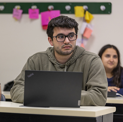 Student listening to a professor's lecture.