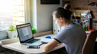 Student working on a laptop