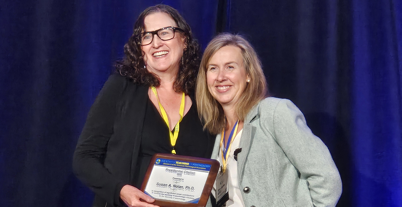 Susan Nolan (left) receives presidential citation from STP President Stephanie Afful (right).
